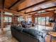 Open-concept living room with hardwood floors, fireplace, and a view of the dining area at 7037 Indian Lake W Blvd, Indianapolis, IN 46236