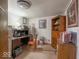 Cozy home office with vintage wooden furniture, desk and chair with room for storage at 7037 Indian Lake W Blvd, Indianapolis, IN 46236