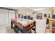 Recreational basement area featuring air hockey, storage, and a lounge area for Gathering fun and entertainment at 715 Stockbridge Dr, Westfield, IN 46074