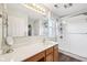 Bathroom with a vanity, large mirror, and a shower with a glass door at 715 Stockbridge Dr, Westfield, IN 46074