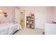 Another view of the bright bedroom featuring two beds, ceiling fan, and large window at 715 Stockbridge Dr, Westfield, IN 46074