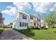 Beautiful home featuring a manicured lawn and a charming front porch with an American flag at 715 Stockbridge Dr, Westfield, IN 46074