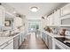 Spacious kitchen with marble countertops, white cabinets, and stainless steel appliances at 715 Stockbridge Dr, Westfield, IN 46074