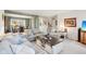Spacious living room with comfortable seating, neutral decor, and an open view to the dining area at 715 Stockbridge Dr, Westfield, IN 46074
