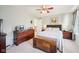 Well-lit main bedroom with a bed, wood dresser, and a wooden chest at 715 Stockbridge Dr, Westfield, IN 46074