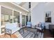 Cozy outdoor patio with comfortable seating, stylish cushions, and a modern coffee table, ideal for relaxation and entertaining at 715 Stockbridge Dr, Westfield, IN 46074
