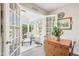 Bright sunroom with many windows and a door to the outside at 715 Stockbridge Dr, Westfield, IN 46074