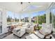 Bright sunroom with large windows, comfortable seating, and natural light, creating a relaxing space to enjoy the outdoors at 715 Stockbridge Dr, Westfield, IN 46074
