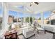 Inviting sunroom with abundant natural light, comfortable seating, and serene decor, perfect for relaxation and enjoying views at 715 Stockbridge Dr, Westfield, IN 46074
