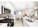 Bright, open kitchen with stainless steel appliances and an adjacent dining area for easy entertaining at 7239 Governors Row, Avon, IN 46123