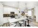 Modern kitchen featuring stainless steel appliances, a breakfast bar, and stylish pendant lighting at 7239 Governors Row, Avon, IN 46123