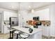 Modern kitchen with a breakfast bar, stainless steel appliances, and contemporary lighting at 7239 Governors Row, Avon, IN 46123