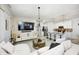 Spacious living area showcasing an open layout, a modern TV, and a well-equipped kitchen at 7239 Governors Row, Avon, IN 46123