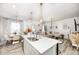 Open concept living space with white walls, modern lighting, and seamless flow from kitchen to living room at 7239 Governors Row, Avon, IN 46123
