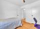 Bedroom with hardwood floors, ceiling fan, and a window for ample natural lighting at 7671 Sherry Ln, Brownsburg, IN 46112