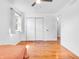 Bedroom featuring hardwood floors, a ceiling fan, closet, and a window providing great natural light at 7671 Sherry Ln, Brownsburg, IN 46112