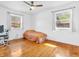 Bright bedroom with hardwood floors, ceiling fan and two windows offering plenty of natural light at 7671 Sherry Ln, Brownsburg, IN 46112