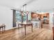 Bright dining room with hardwood floors, natural light, and an adjoining open concept kitchen creates a perfect space at 7671 Sherry Ln, Brownsburg, IN 46112