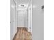 This bright hallway offers well-lit access with white doors and wood-look floors at 7671 Sherry Ln, Brownsburg, IN 46112