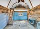 Rustic interior featuring wood walls, blue accent, ladder, and a loft area, creating a unique, unfinished space at 7671 Sherry Ln, Brownsburg, IN 46112