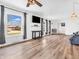 Large living room boasts big windows, natural light, and hardwood floors, ideal for modern living at 7671 Sherry Ln, Brownsburg, IN 46112
