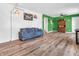 Bright living room with an open layout and stylish hardwood floors, perfect for entertaining and everyday living at 7671 Sherry Ln, Brownsburg, IN 46112