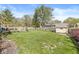 Spacious backyard with a well-maintained lawn, shed, and wooden fence at 768 Grace Ct, Carmel, IN 46032