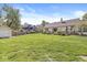 Expansive backyard featuring green lawn, a detached shed, and a house with an inviting outdoor deck at 768 Grace Ct, Carmel, IN 46032