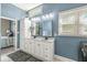 Bathroom featuring double sinks with vanity, lighting, and views into the bedroom at 768 Grace Ct, Carmel, IN 46032