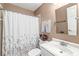 Cozy bathroom featuring a shower/tub combo with floral shower curtain, and a white vanity at 768 Grace Ct, Carmel, IN 46032