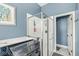 A partial view of a bathroom with a glass shower and a nearby washer at 768 Grace Ct, Carmel, IN 46032