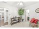 Bright bedroom featuring neutral carpet, a ceiling fan, and decorative furnishings with access to bathroom at 768 Grace Ct, Carmel, IN 46032
