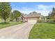 Charming brick home with a two-car garage, driveway, and well-kept lawn at 768 Grace Ct, Carmel, IN 46032