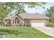 Beautiful brick house with an attached garage, a well-maintained lawn, and an inviting front entrance at 768 Grace Ct, Carmel, IN 46032