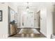 Inviting foyer with a decorative mirror, hardwood floors, and a clear view of the front door at 768 Grace Ct, Carmel, IN 46032