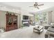 Spacious living room featuring a fireplace, a built-in cabinet, and sliding doors to an outdoor space at 768 Grace Ct, Carmel, IN 46032