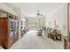 Open living room with a fireplace, a large cabinet, and sliding doors that lead to a patio at 768 Grace Ct, Carmel, IN 46032
