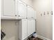 Mudroom offering lots of storage space with white cabinets and coat hooks on the wall at 768 Grace Ct, Carmel, IN 46032