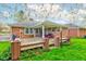 Backyard patio with dining area and well-manicured lawn and landscape at 7756 N Audubon Rd, Indianapolis, IN 46250