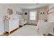 Charming Bedroom with two cribs, floral accents, and a cozy white rug creating a soothing atmosphere at 7756 N Audubon Rd, Indianapolis, IN 46250