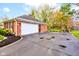Brick home with attached garage and spacious driveway on a sunny day at 7756 N Audubon Rd, Indianapolis, IN 46250