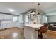 Spacious white kitchen with modern appliances, breakfast bar, and bright natural lighting at 7756 N Audubon Rd, Indianapolis, IN 46250