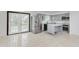 Bright kitchen features stainless steel appliances, gray cabinetry, and an island with a white countertop at 8041 Barry Rd, Indianapolis, IN 46219