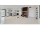 Open-concept living room featuring a modern kitchen, neutral paint, tile floors, and fireplace at 8041 Barry Rd, Indianapolis, IN 46219