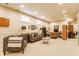 Finished basement area with neutral carpet, two sofas, a desk, and recessed lighting at 902 N College Ave, Indianapolis, IN 46202