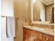 Bathroom features a granite countertop, a modern sink, and wooden cabinets with ample storage space at 902 N College Ave, Indianapolis, IN 46202