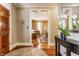 Inviting foyer with hardwood floors, elegant decor, and a view into the adjacent living space at 902 N College Ave, Indianapolis, IN 46202