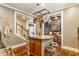 Spacious kitchen with an island, stainless appliances, and open layout to the living room and staircase at 902 N College Ave, Indianapolis, IN 46202