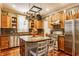 Charming kitchen with wood cabinets, stainless steel appliances, and granite countertops at 902 N College Ave, Indianapolis, IN 46202