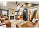 Inviting living room featuring a fireplace, built-in bookshelves, and comfortable leather seating at 902 N College Ave, Indianapolis, IN 46202